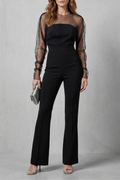 Veloura Sheer Illusion Neckline Flared Leg Jumpsuit in Black